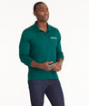 Model is wearing UNTUCKit Wrinkle-Free Long-Sleeve Damaschino Polo in Cyan Green.