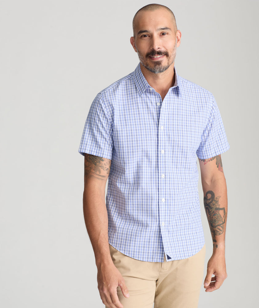 Model is wearing UNTUCKit Dante Short sleeve wrinkle-free shirt.