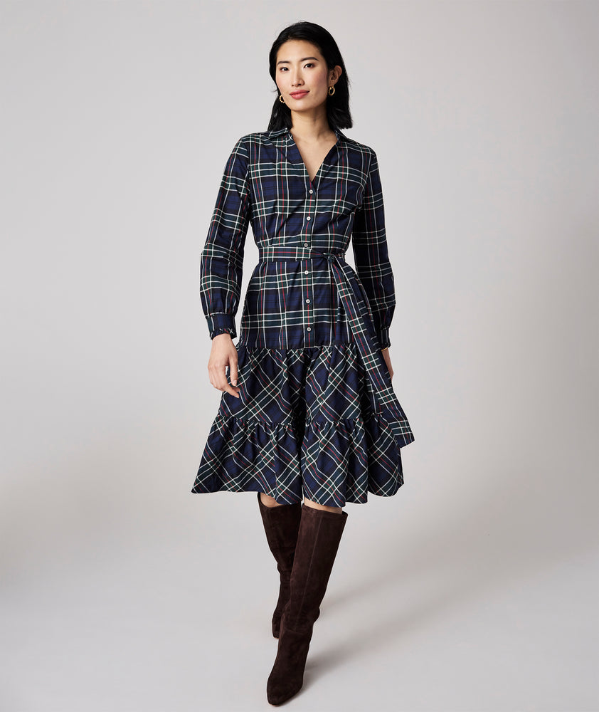 Model is wearing UNTUCKit Dara dress in navy plaid.