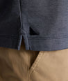 Model is wearing UNTUCKit LS Day Performance Polo in Evening Blue.