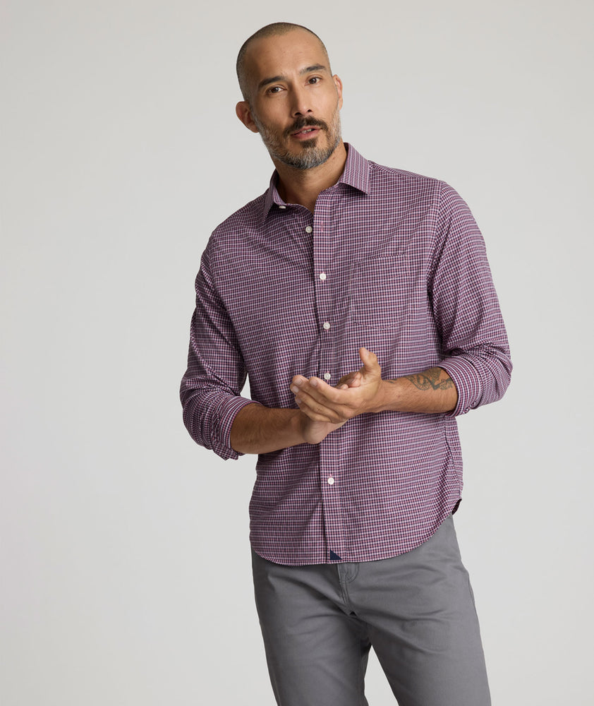 Model is wearing UNTUCKit performance Delune shirt in red. 