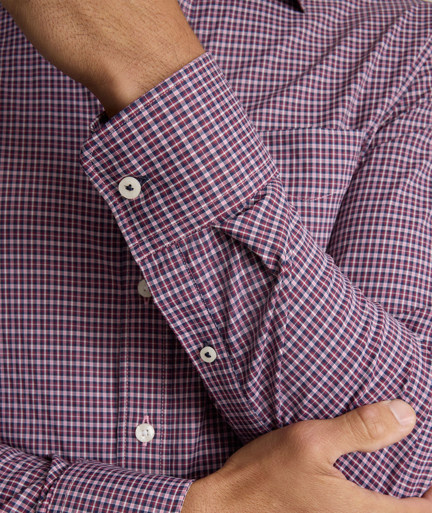 Model is wearing UNTUCKit performance Delune shirt in red. 