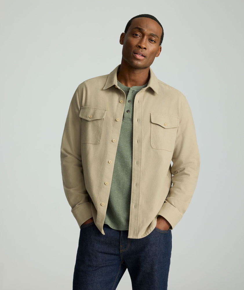 Model is wearing UNTUCKit Brushed Overshirt in laural oak. 