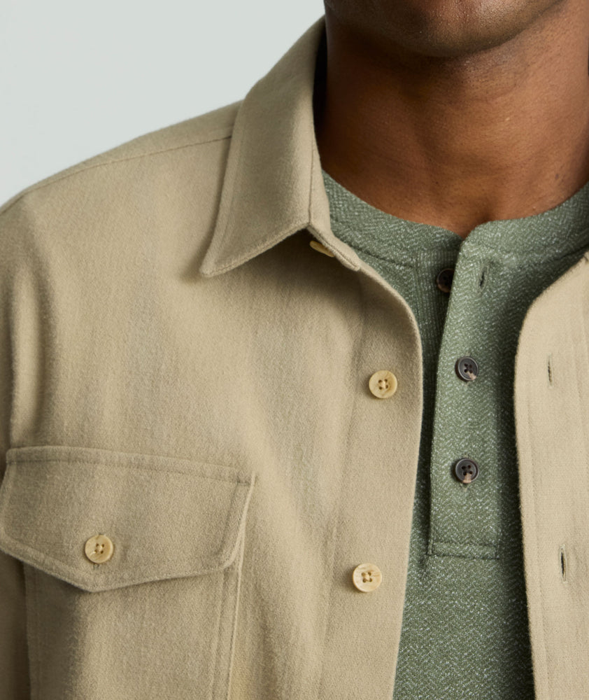 Model is wearing UNTUCKit Brushed Overshirt in laural oak. 