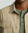 Model is wearing UNTUCKit Brushed Overshirt in laural oak. 