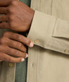 Model is wearing UNTUCKit Brushed Overshirt in laural oak. 