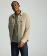 Model is wearing UNTUCKit Brushed Overshirt in laural oak. 