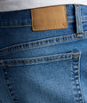 Model is wearing UNTUCKit denim in rinse. 