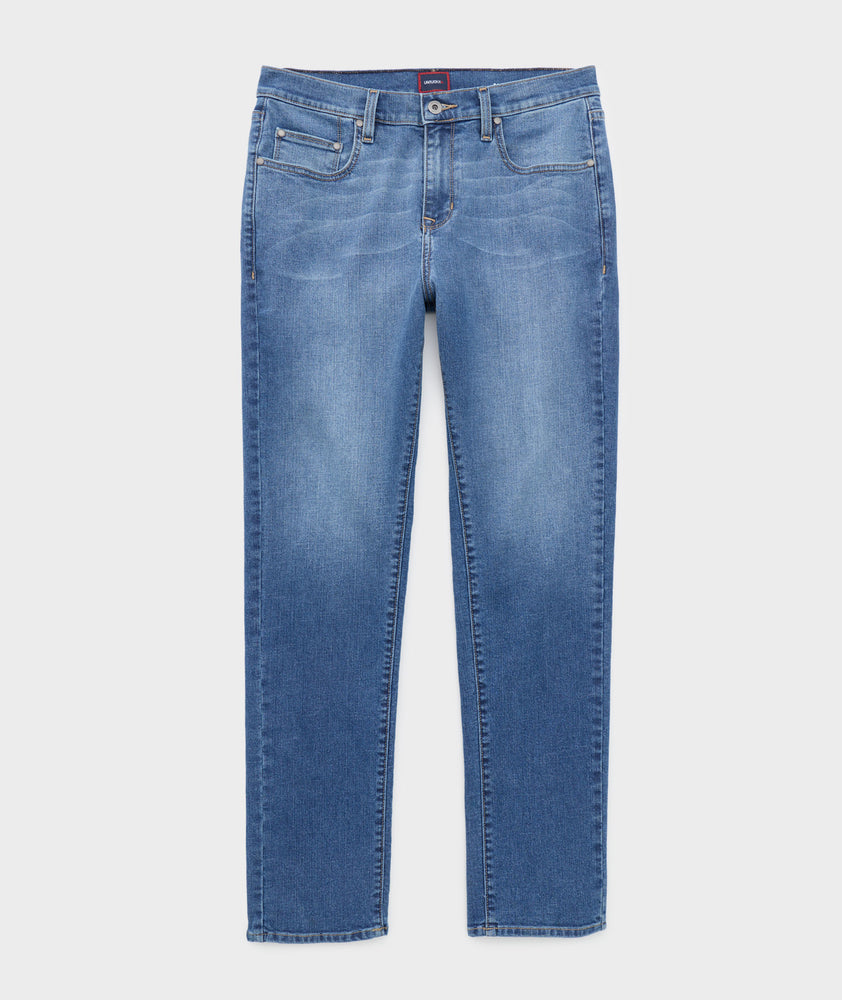 Model is wearing UNTUCKit denim in rinse. 