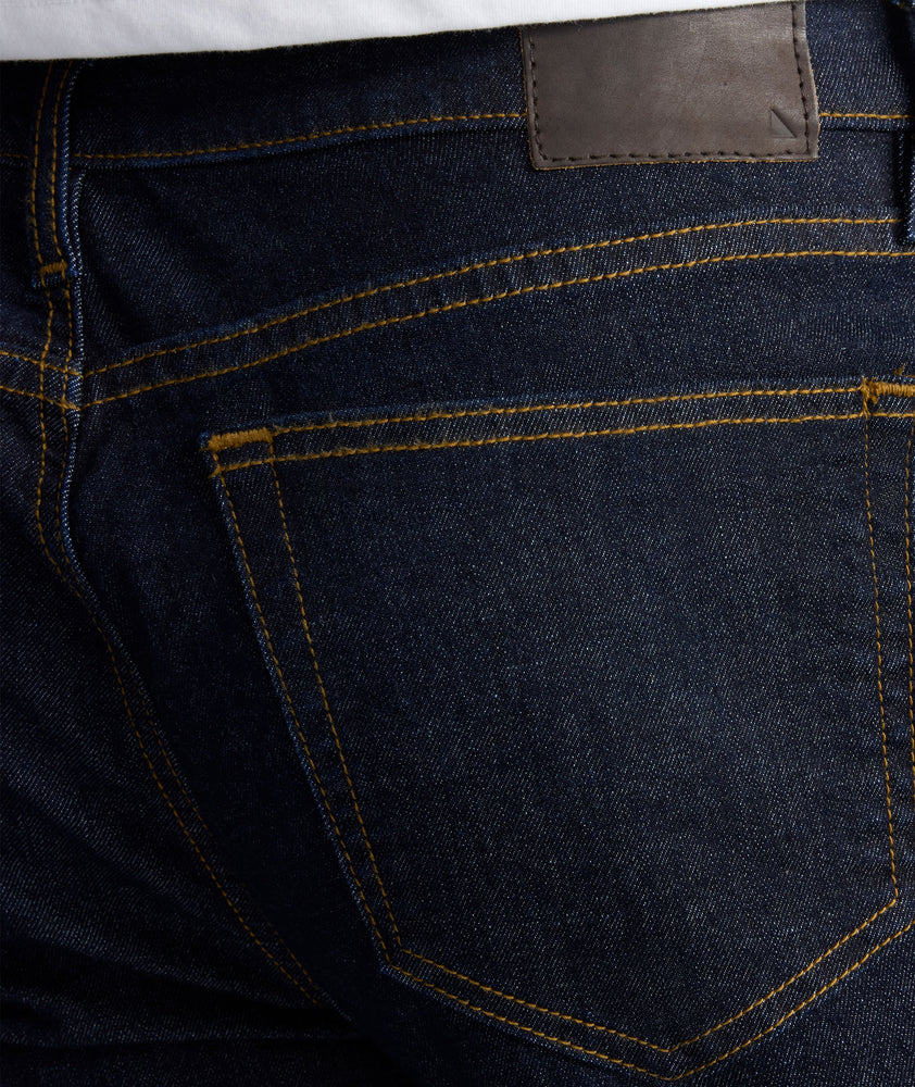 Model is wearing UNTUCKit Dark Wash Denim. 