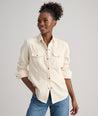 Model is wearing UNTUCKit Dolly shirt in Ecru.
