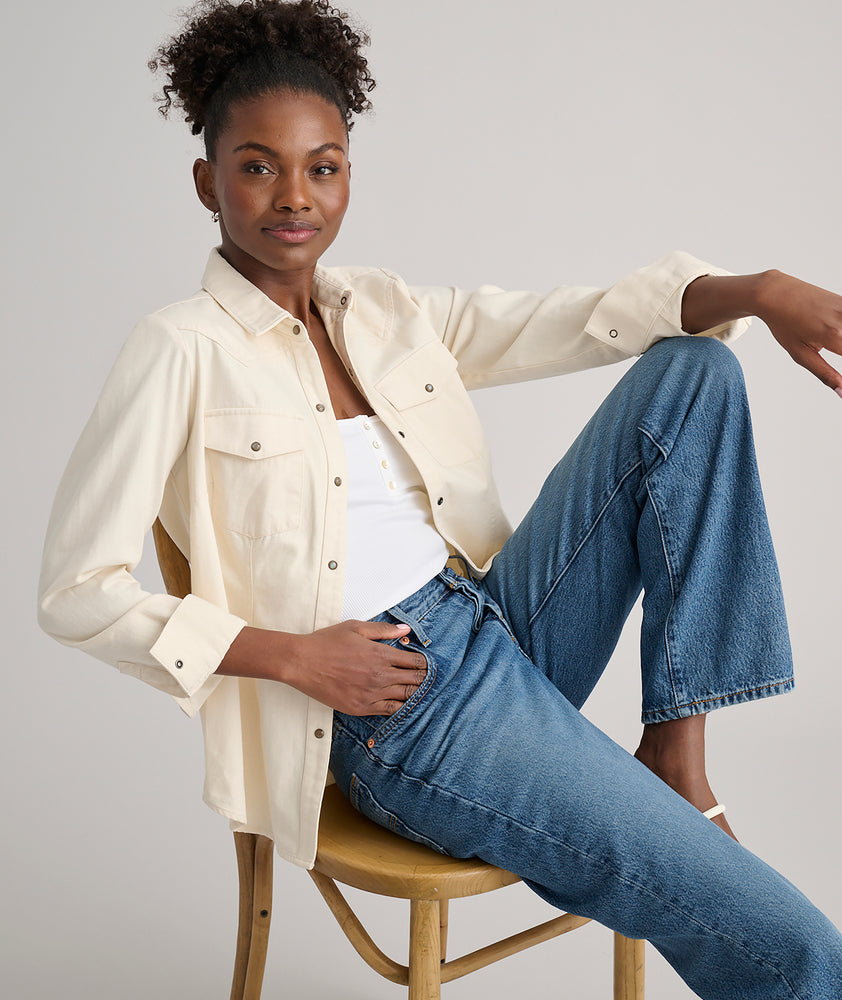 Model is wearing UNTUCKit Dolly shirt in Ecru.