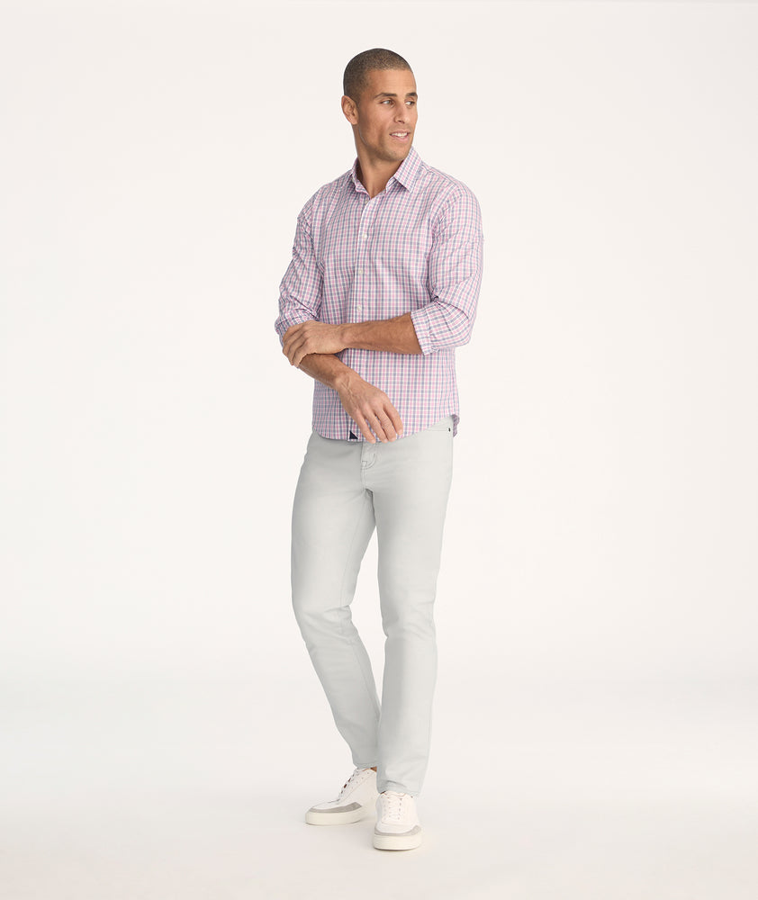 Model is wearing UNTUCKit 5-Pocket Chino Pants in light gray - full body