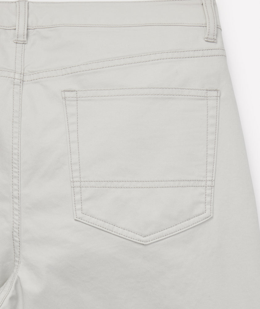 Model is wearing UNTUCKit 5-Pocket Chino Pants in light gray.