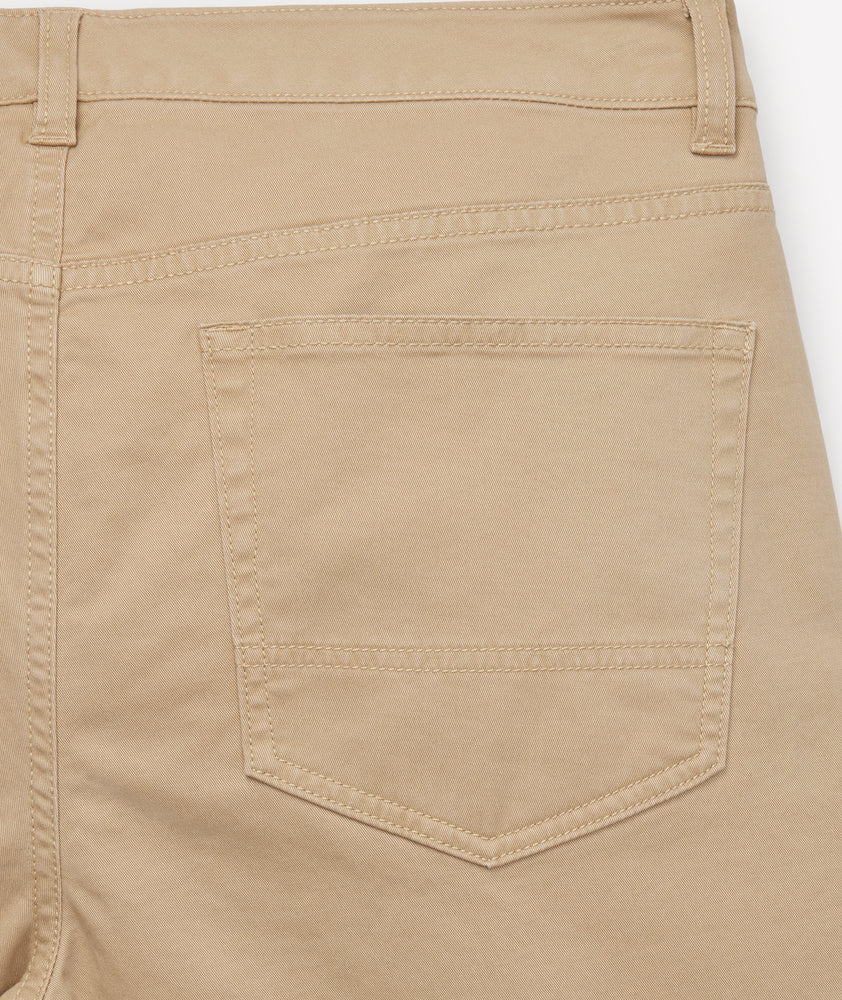 Model is wearing UNTUCKit 5-Pocket Chino Pants in Khaki.
