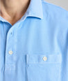 Model is wearing UNTUKit Vintage Wash Polo in Garment Dyed Blue. 