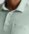 Model is wearing UNTUKit Vintage Wash Polo in Garment Dyed green. 