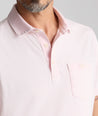 Model is wearing UNTUKit Vintage Wash Polo in Garment Dyed pink. 