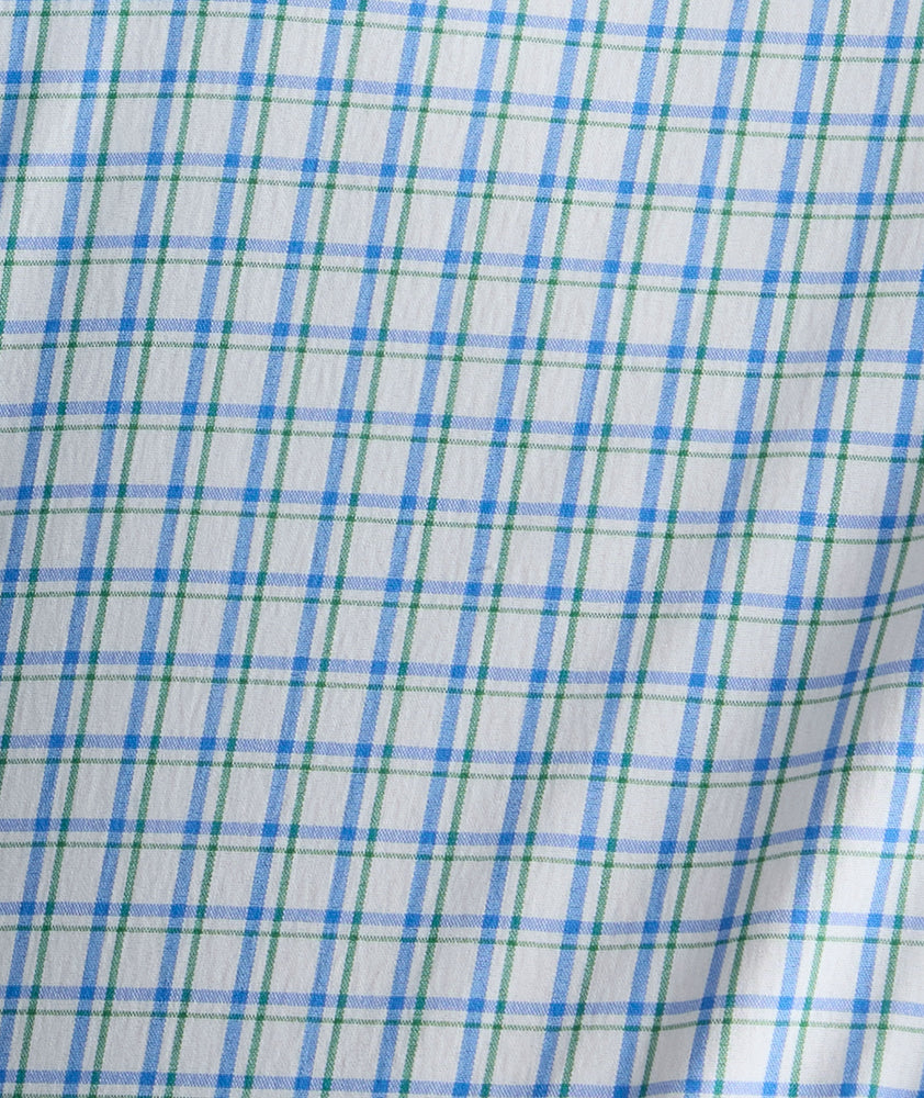 Model is wearing UNTUCKit Wrinkle-Free Dunsmore Shirt in green plaid. 