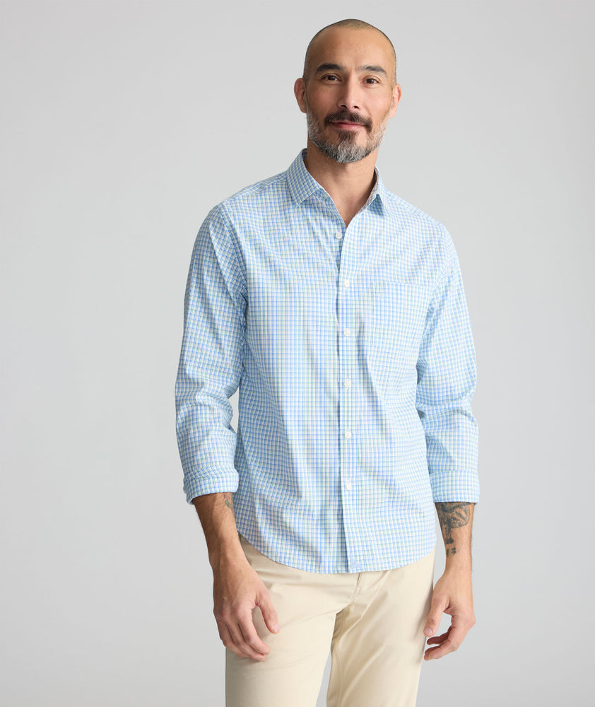 Model is wearing UNTUCKit Wrinkle-Free Dunsmore Shirt in green plaid. 