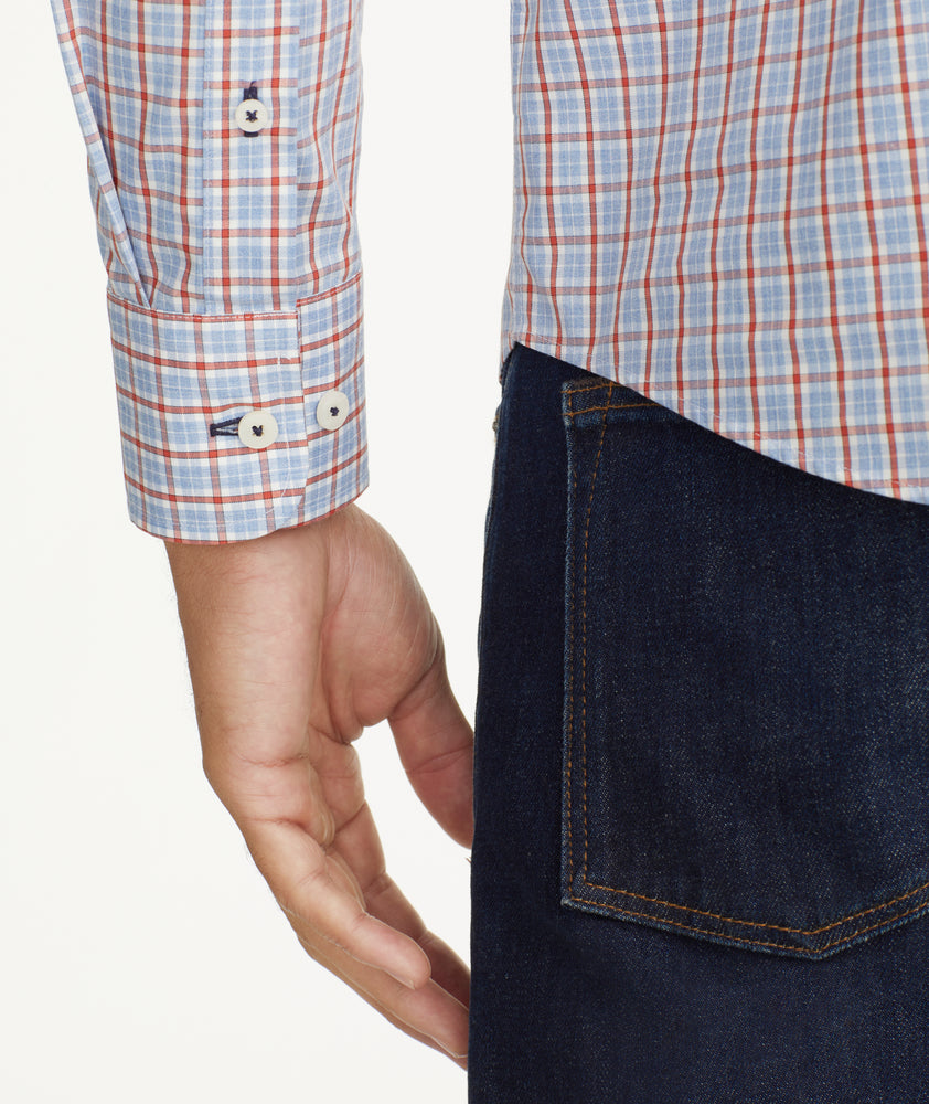 Model is wearing UNTUCKit Wrinkle-Free Dutton Shirt in Blue& Red Check.