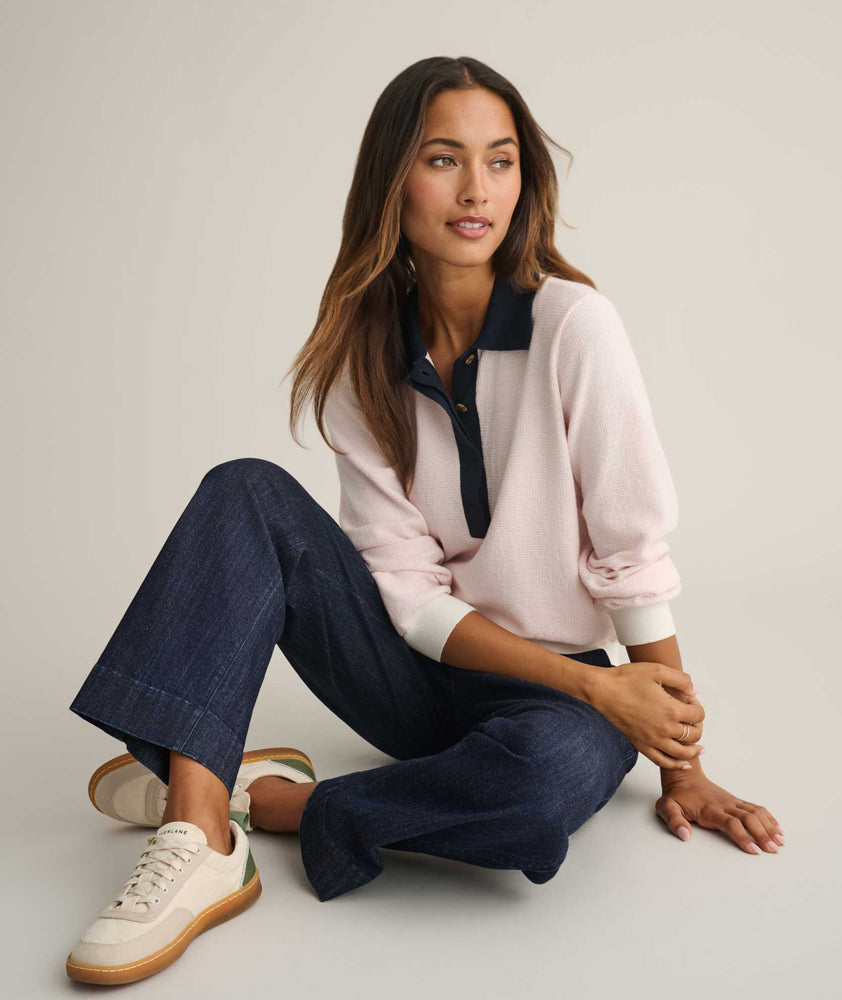 Model is wearing UNTUCKit Cotton-Cashmere Edyta Sweater Polo in pink. 