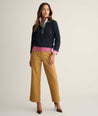 Model is wearing UNTUCKit Cotton-Cashmere Edyta Sweater Polo in navy. 