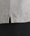 Model is wearing UNTUCKit Elvria Long sleeve polo in heather grey. 