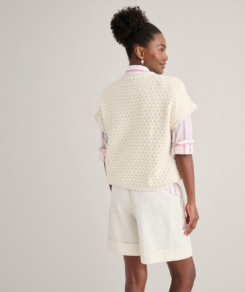 Model is wearing UNTUCKit Cotton Cap Sleeve Emily Sweater. 