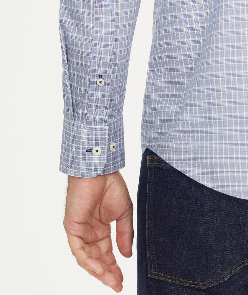 Model is wearing UNTUCKit Wrinkle-Free Erryk Shirt in Small Navy Check.