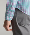 Model is wearing UNTUCKit Fairchild wrinkle free shirt in green. 