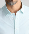 Model is wearing UNTUCKit Performance Fairfax Shirt. 