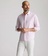 Model is wearing UNTUCKit Performance Fairfax Shirt in pink. 
