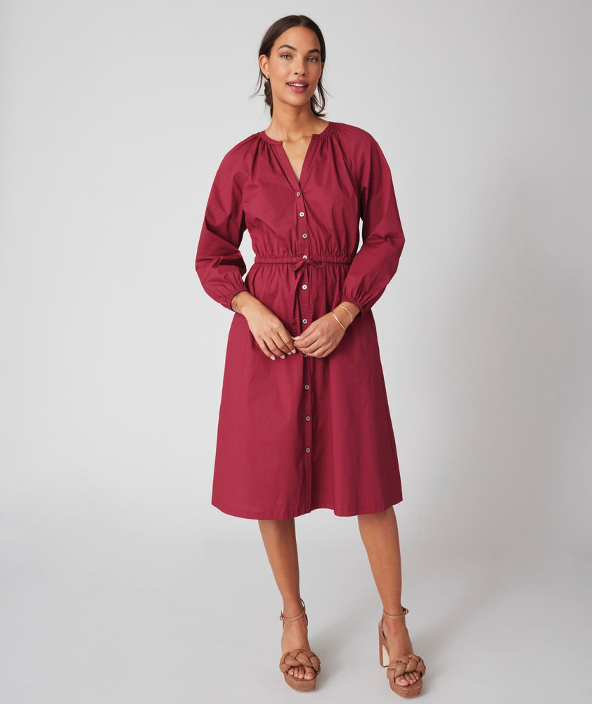 Model is wearing UNTUCKit  Farrah dress in red. 