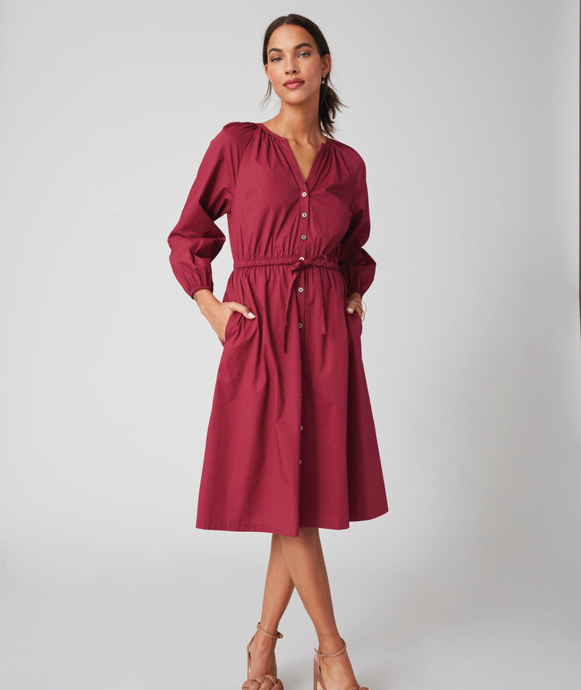 Model is wearing UNTUCKit Farrah dress in red.