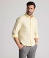 Model is wearing UNTUCKit Farnsworth in vintage wash solid sunshine. 