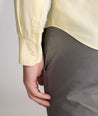 Model is wearing UNTUCKit Farnsworth in vintage wash solid sunshine. 