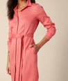 Model is wearing UNTUCKit Felicity dress in pink.