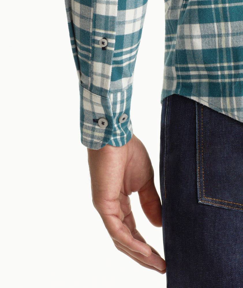 Model is wearing UNTUCKit Wrinkle-Free Performance Flannel Ferney Shirt in teal plaid.