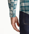 Model is wearing UNTUCKit Wrinkle-Free Performance Flannel Ferney Shirt in teal plaid.