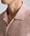 Model is wearing UNTUCKit Wrinkle-Resistant Linen Short-Sleeve Finnegan Shirt in tan. 