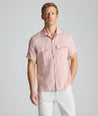 Model is wearing UNTUCKit Wrinkle-Resistant Linen Short-Sleeve Finnegan Shirt in tan. 