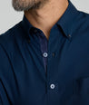 Model is wearing UNTUCKit Fonteplant shirt in navy. 