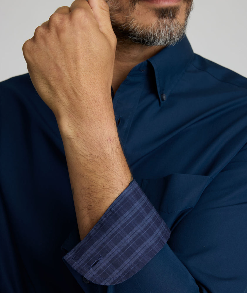 Model is wearing UNTUCKit Fonteplant shirt in navy. 