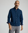 Model is wearing UNTUCKit Fonteplant shirt in navy. 