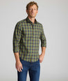 Model is wearing UNTUCKit Wrinkle-Free Foxvine Shirt in green. 