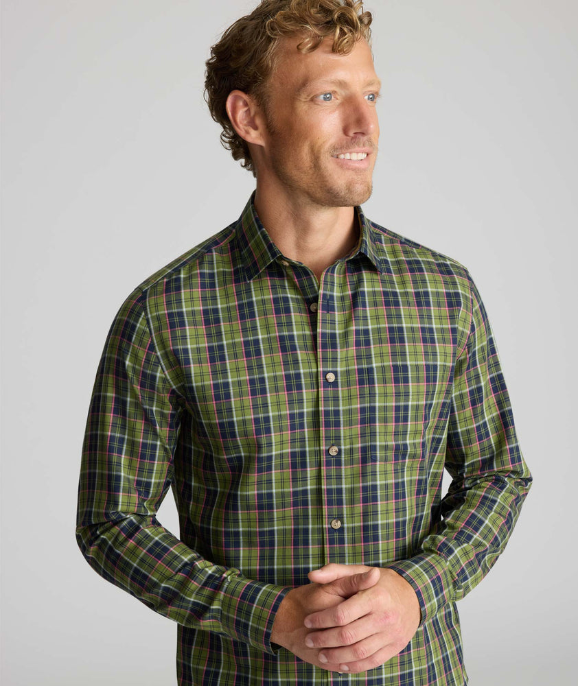 Model is wearing UNTUCKit Wrinkle-Free Foxvine Shirt in green. 