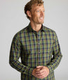 Model is wearing UNTUCKit Wrinkle-Free Foxvine Shirt in green. 