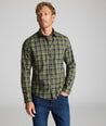 Model is wearing UNTUCKit Wrinkle-Free Foxvine Shirt in green. 