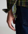 Model is wearing UNTUCKit Wrinkle-Free Foxvine Shirt in green. 
